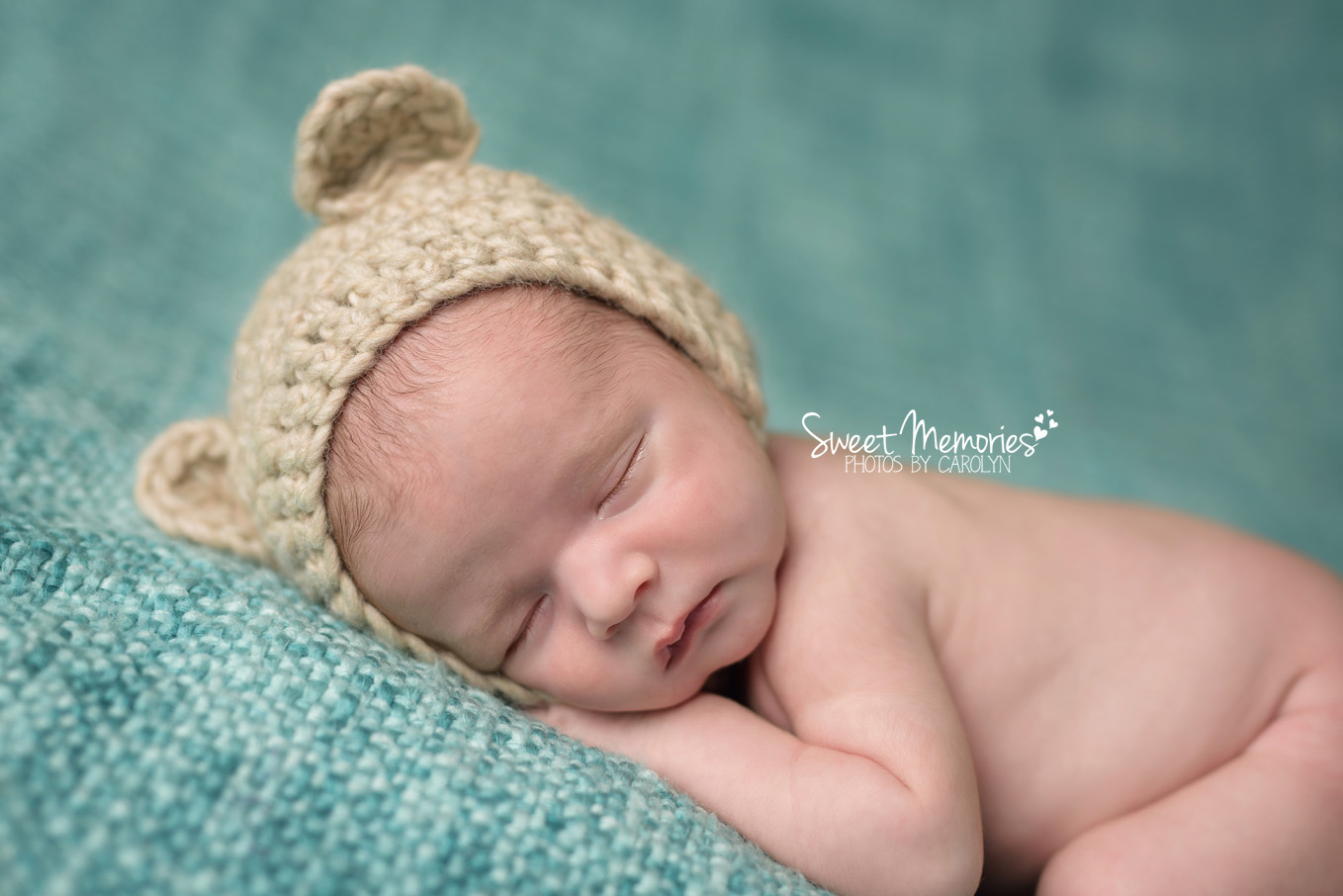 newborn in bear hat