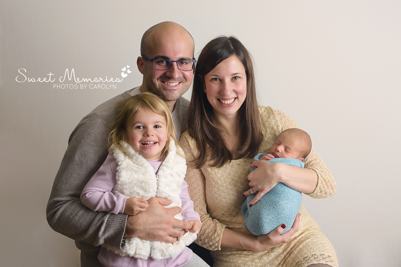 happy family from Lansdale pose with newborn boy and toddler sibling in Quakertown photography studio | Sweet Memories Photos by Carolyn