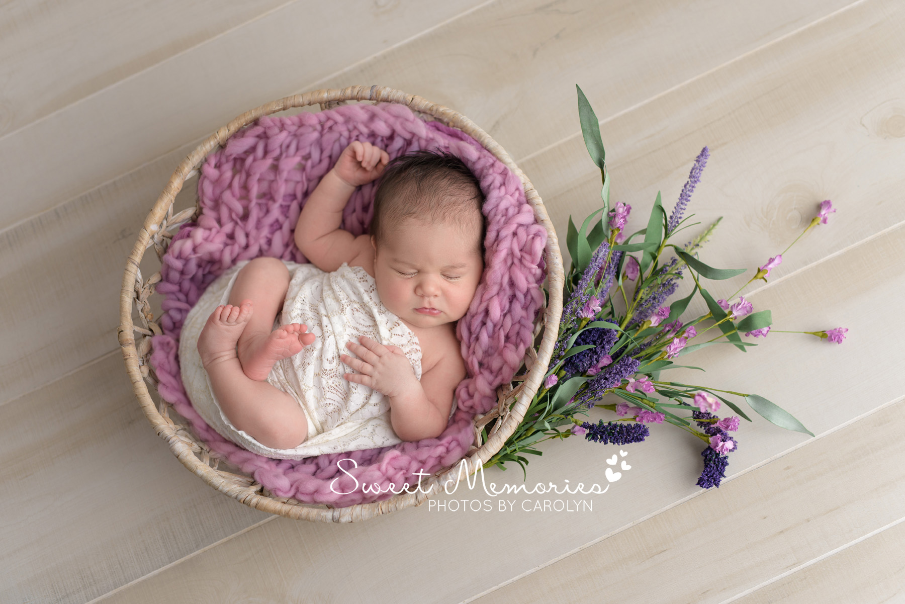 newborn baby girl in basket with flowers | Coopersburg newborn photographer | Sweet Memories Photos by Carolyn Quakertown Pennsylvania