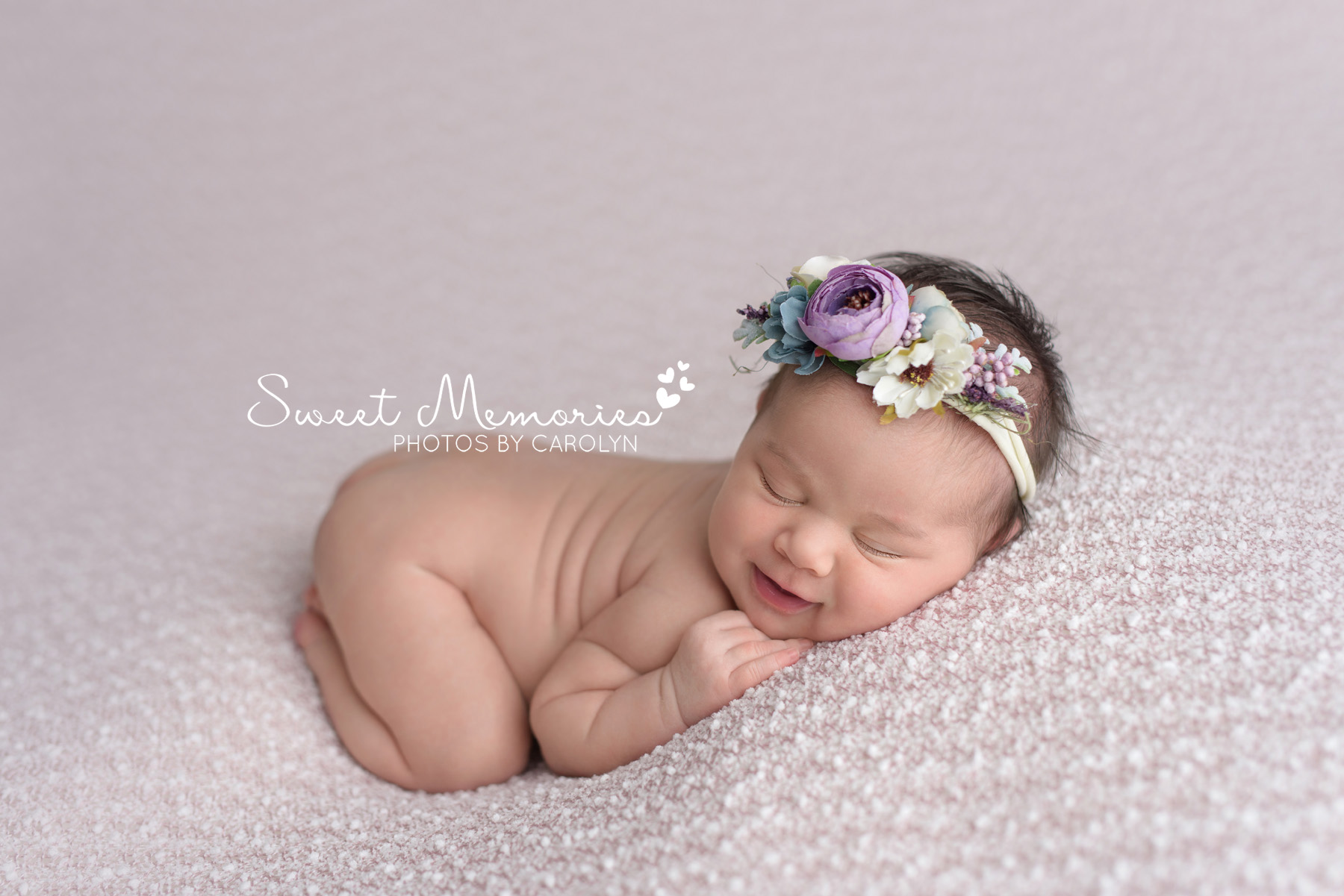 smiling newborn baby bum up pose with flower headband | Coopersburg newborn photographer | Sweet Memories Photos by Carolyn Quakertown Pennsylvania