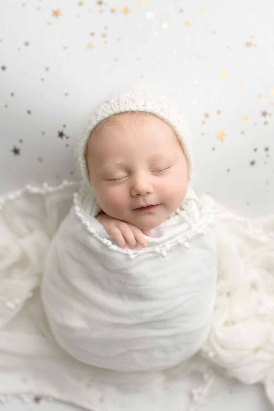 Newborn photography Austin wrapped baby girl on star backdrop
