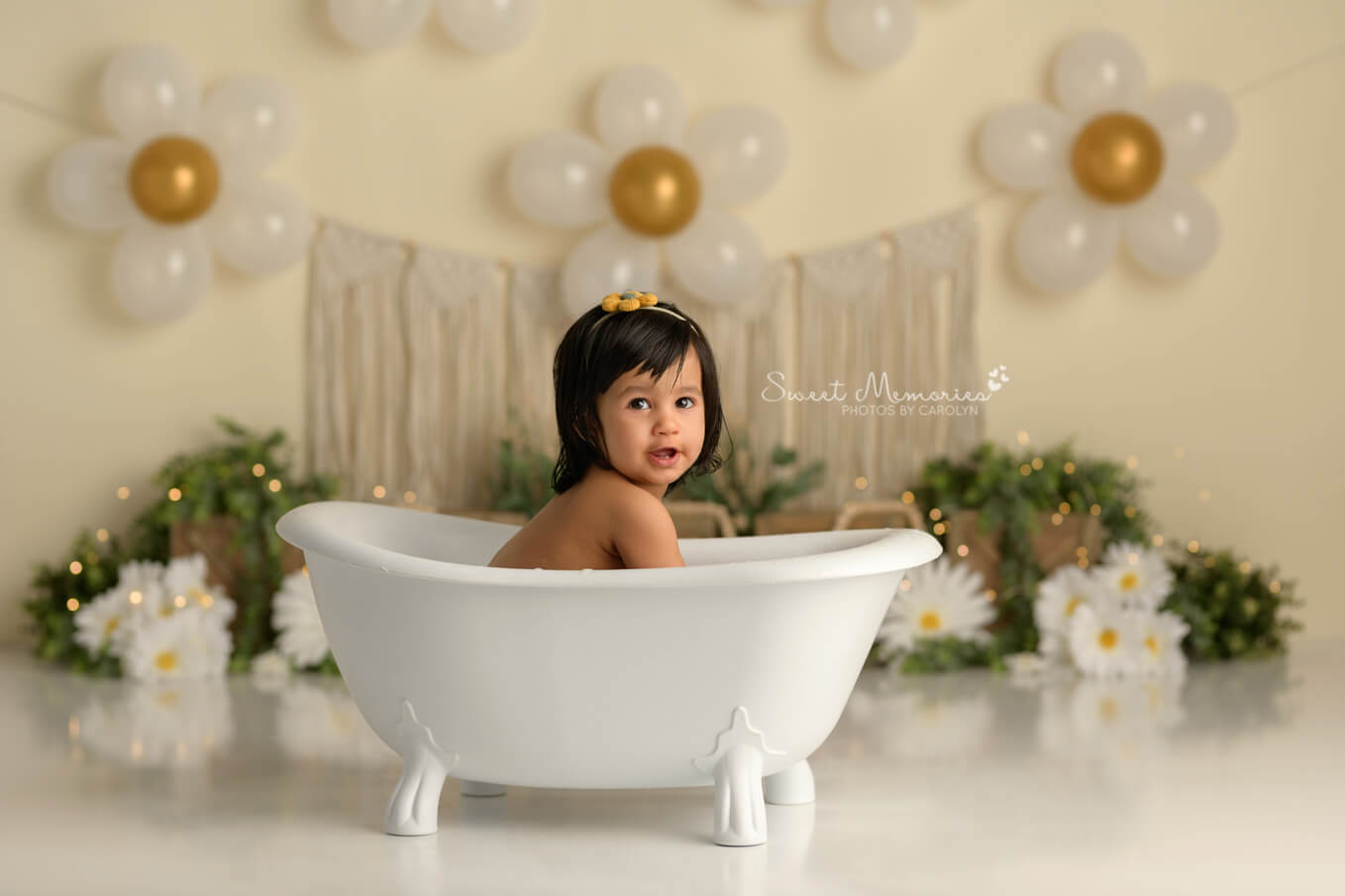 one year old baby girl in tub with boho daisy backdrop | First birthday cake smash photography Round Rock TX